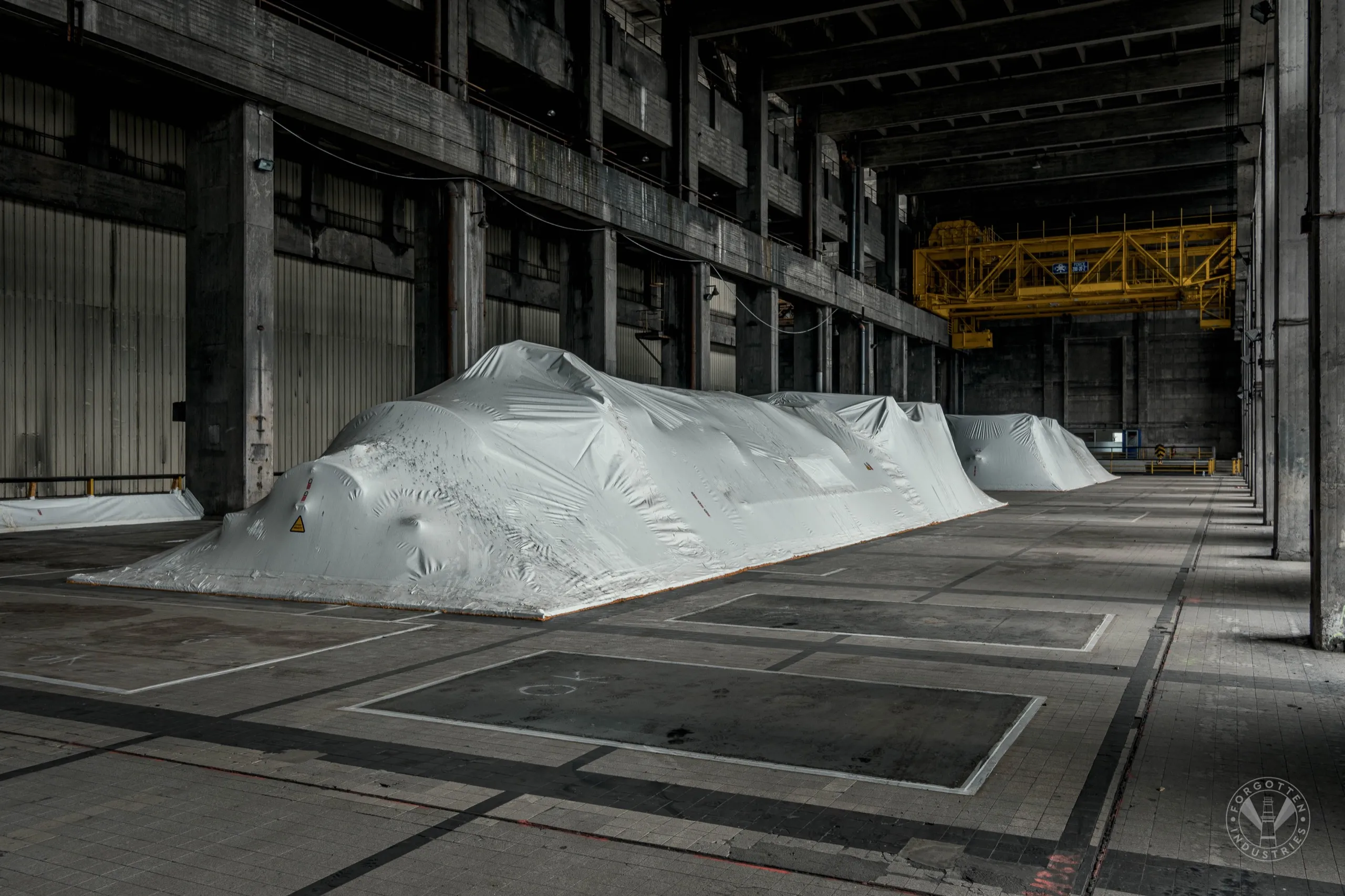 The older units has been stripped of asbestos and put under a cover. They are gone for good.